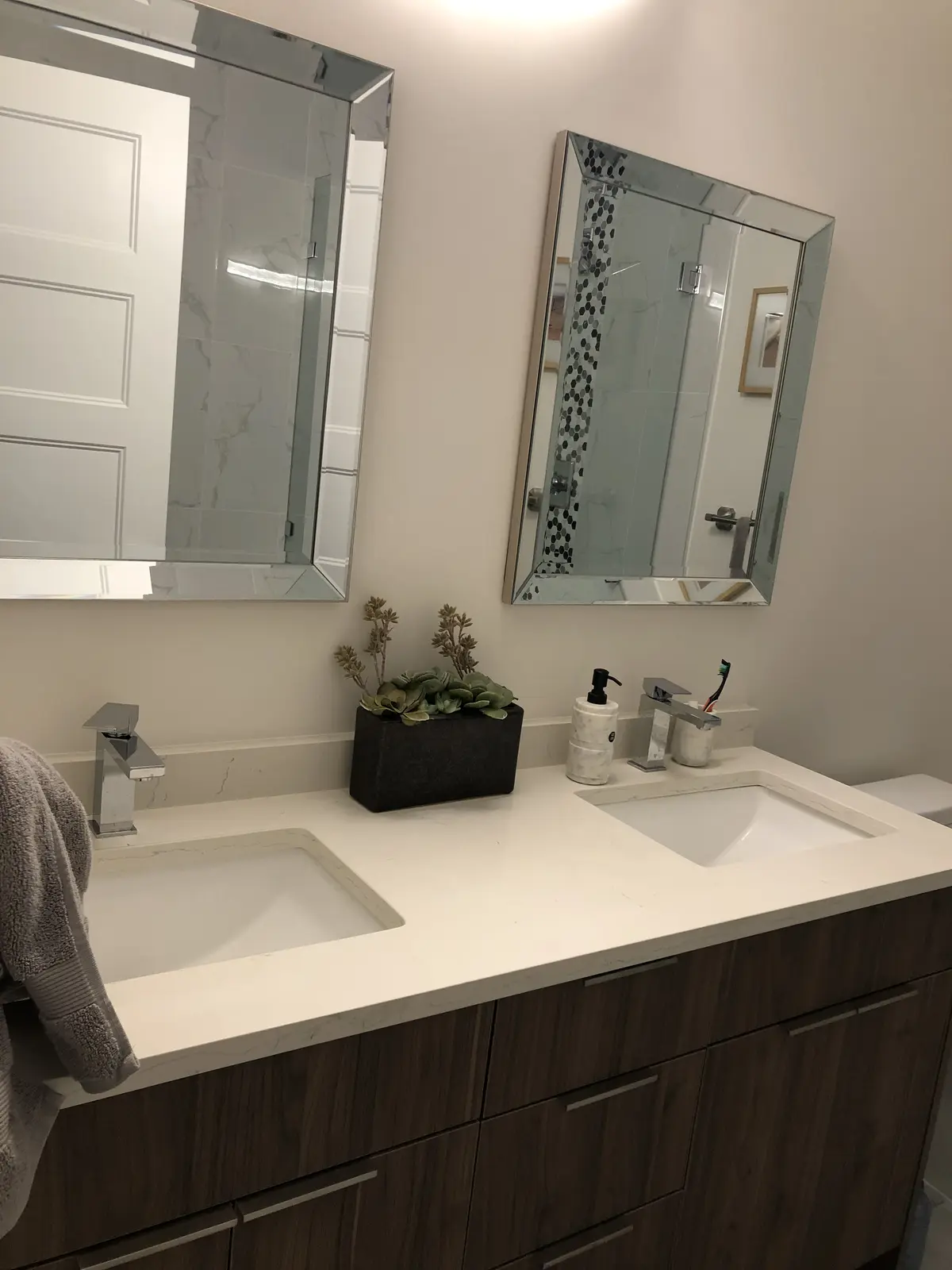 Alternate angle of Aisha's Jewel master bathroom showing soaker tub and glass shower