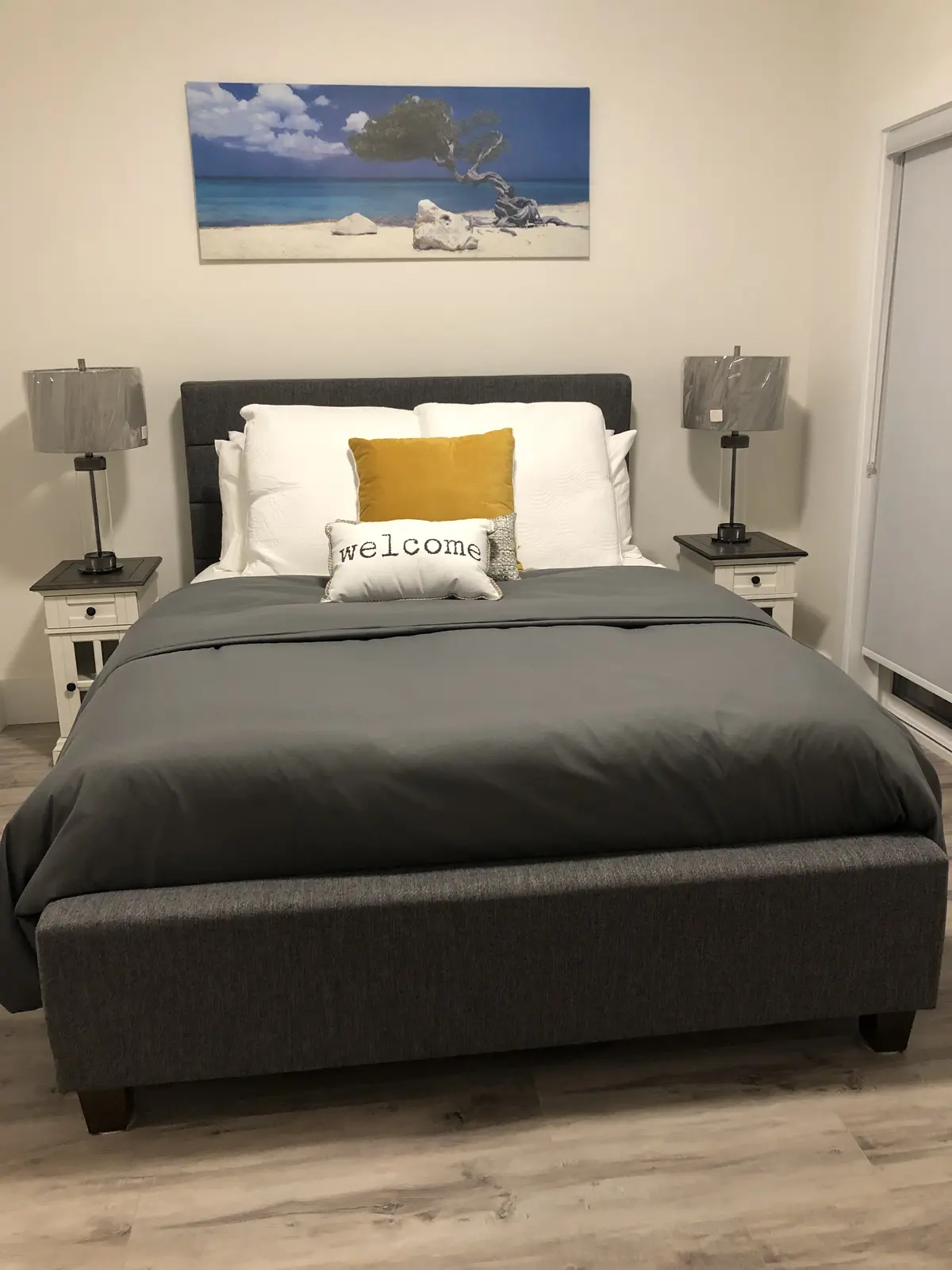 Aisha's Jewel master bedroom with king bed, white bedding and modern elegant furnishings