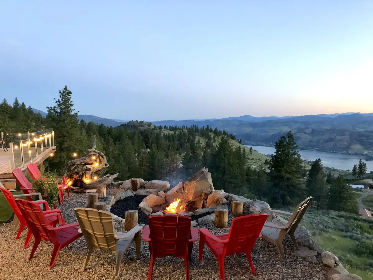 Fire pit at Vista Peak Estate with lake views at dusk