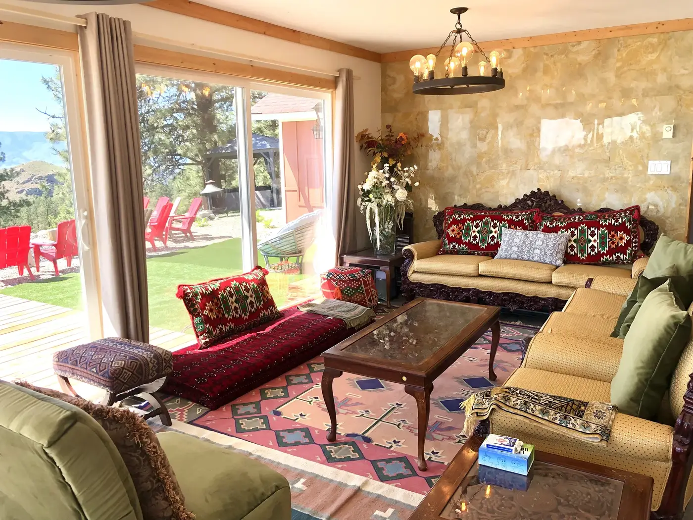 Summit Retreat living room textured accent wall with chandelier and colorful eclectic furniture